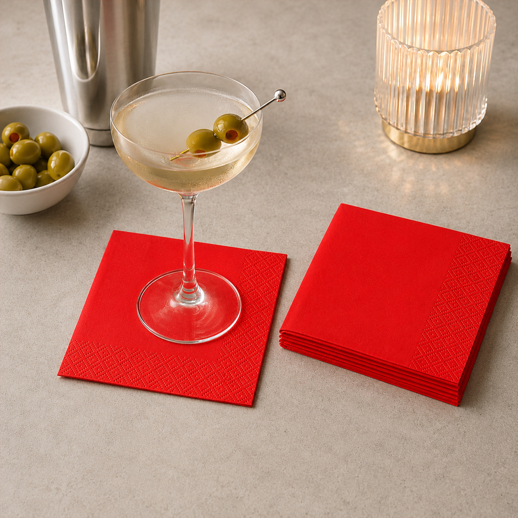 red cocktail paper napkins styled on a party table