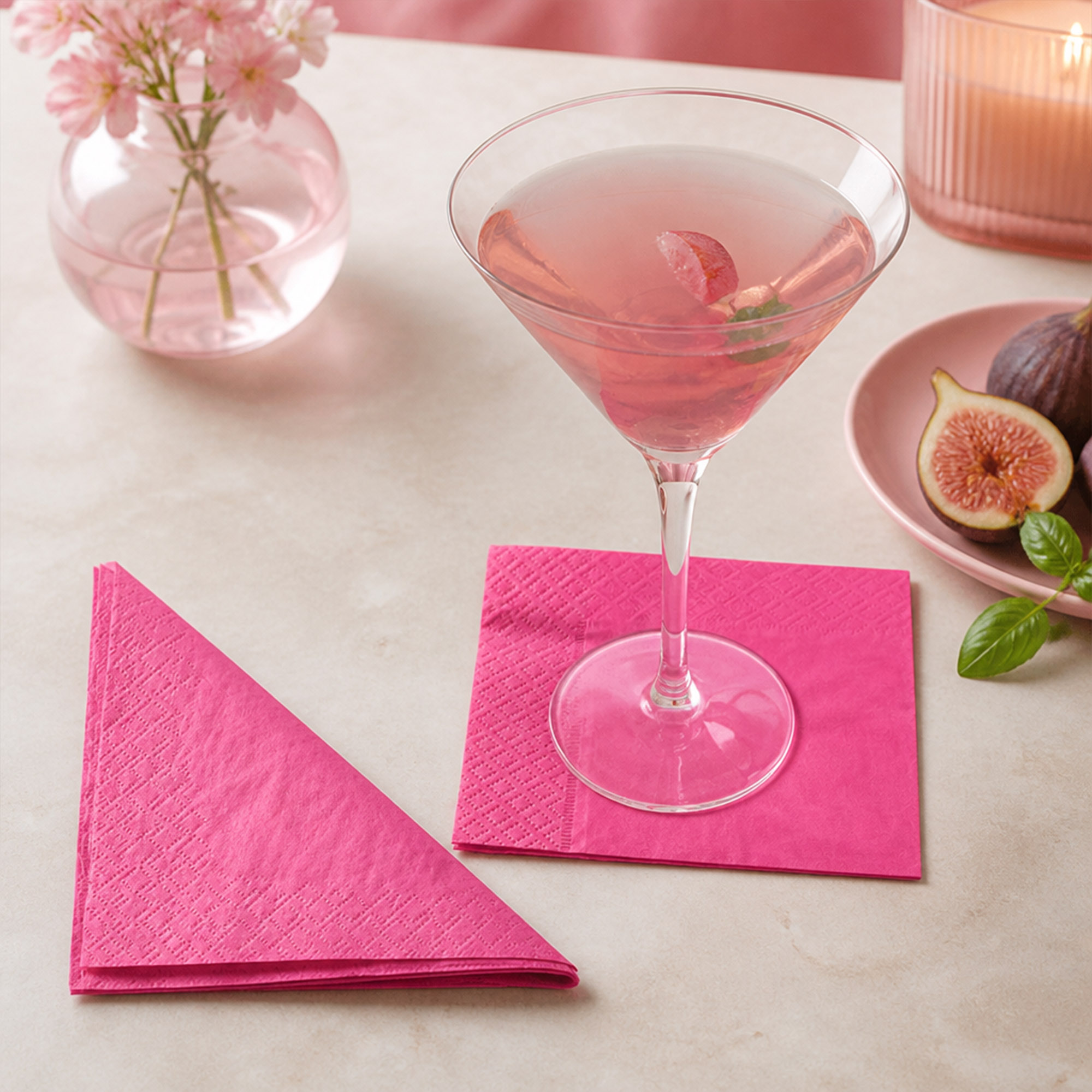 pink cocktail paper napkins styled on a party table